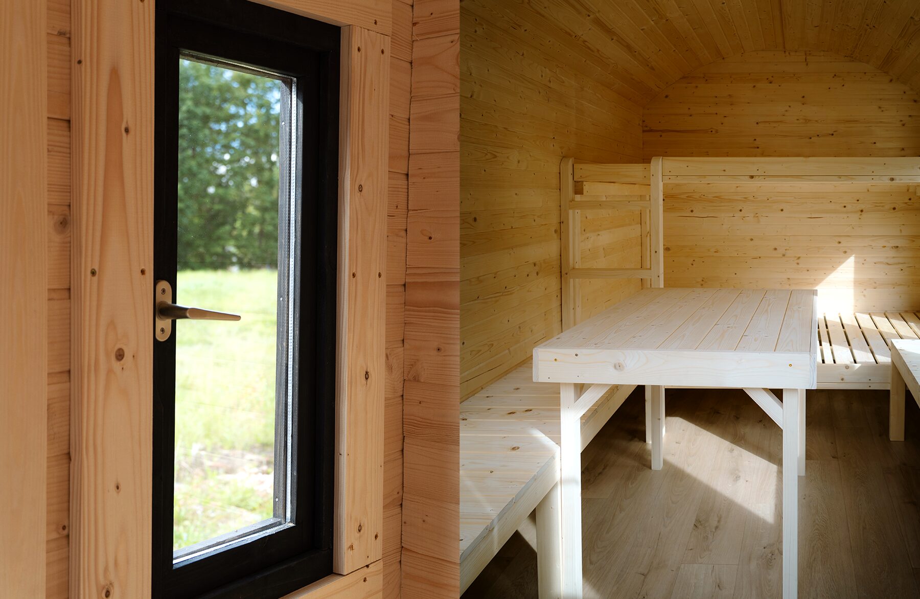 Detailed interior view of a Makoya Spa tiny house CERES: On the left, a narrow window with a black frame offering a view of the greenery outside; on the right, the open living area with a light wooden table, benches, and bunk beds. The natural wood interior and daylight create a bright and cozy living space.
