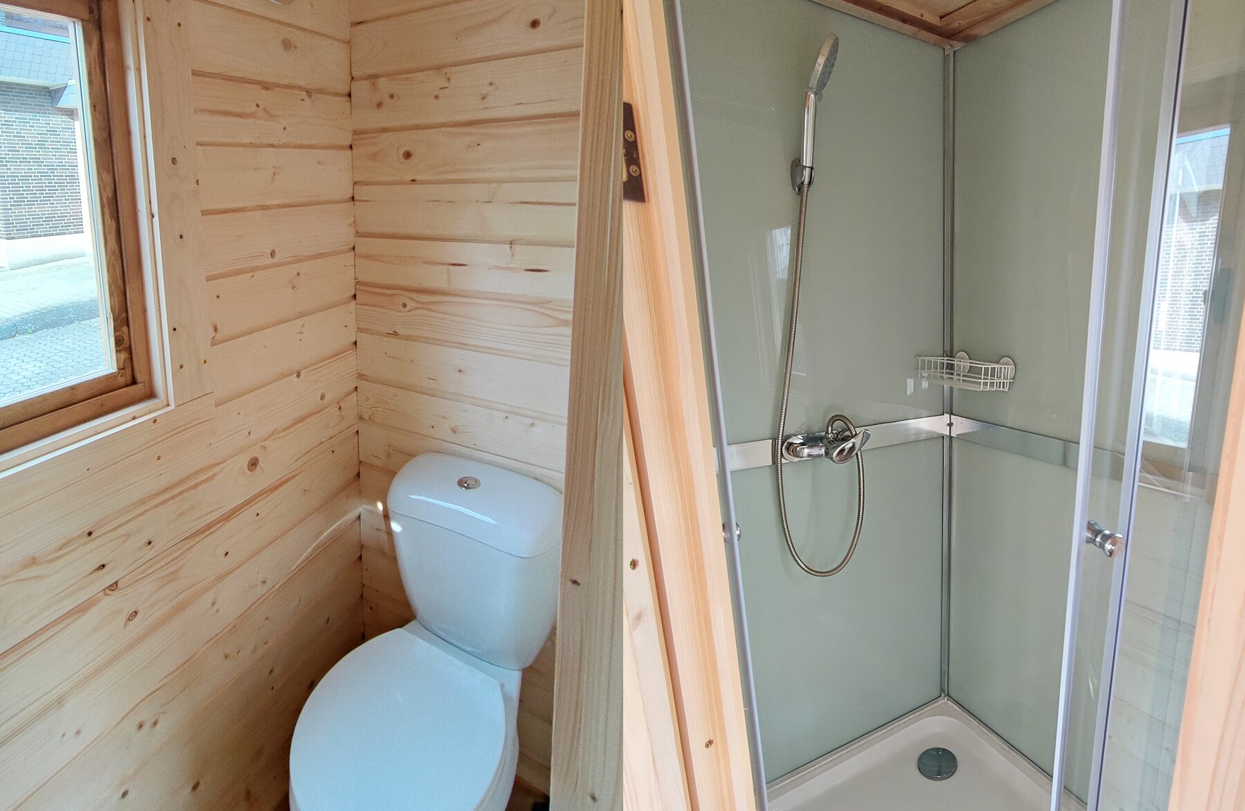 Interior view of a Makoya Spa tiny house DELUXE bathroom: on the left, a compact toilet area with light wood paneling and a window providing natural light; on the right, a modern shower with glass walls, a handheld showerhead, and an integrated shelf, designed to be space-saving and functional.